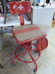 Loved this industrial stool with its Swiss Army blanket upholstery + Swiss cross!